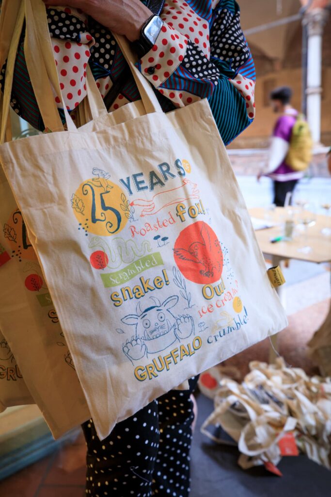 A close up of a branded cotton tote goodie bags, printed with images and text celebrating the 25th Anniversary of The Gruffalo.