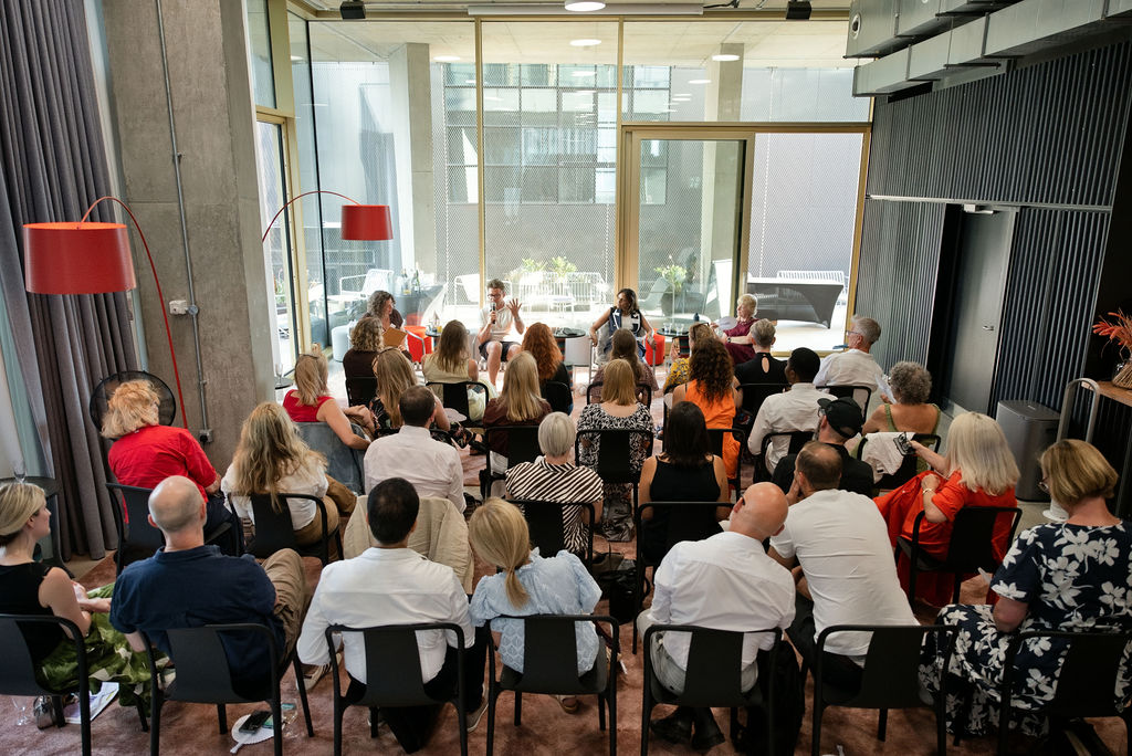 The full audience in attendance at the Maykn launch event seated and facing panelists at the front.